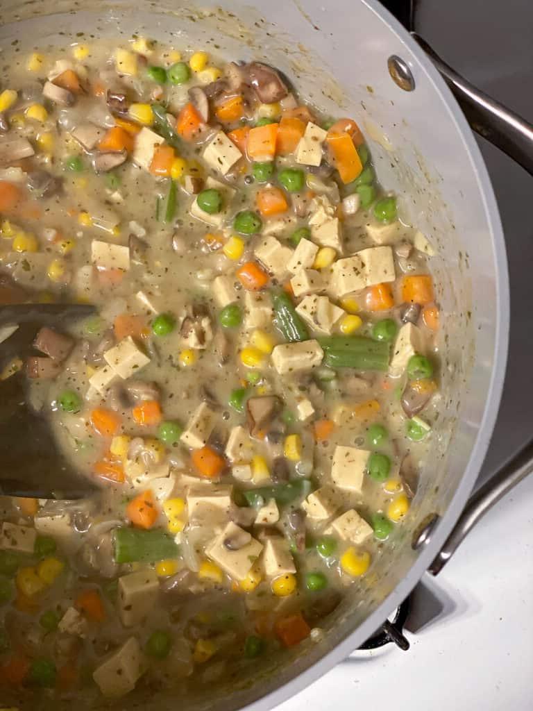 process shot of ingredients cooking in pan