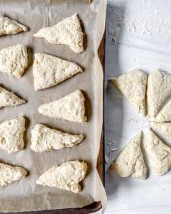 process of vanilla scones shaped into triangles on baking sheet