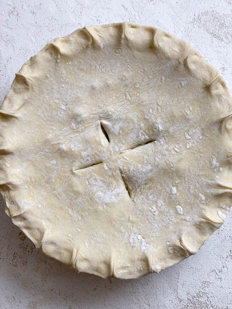 unbaked Mixed Vegetable Vegan Pot Pie on white surface