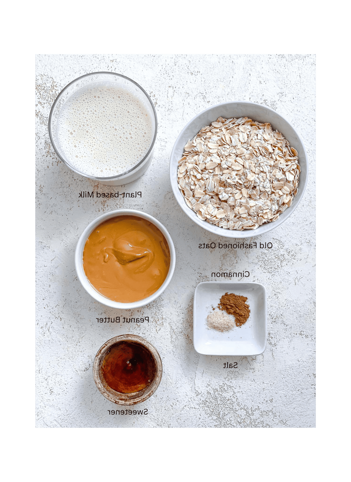 Einfacher Erdnussbutter-Porridge (+ Extras) 3 ingredients for Easy Peanut Butter Oatmeal measured out against a white surface