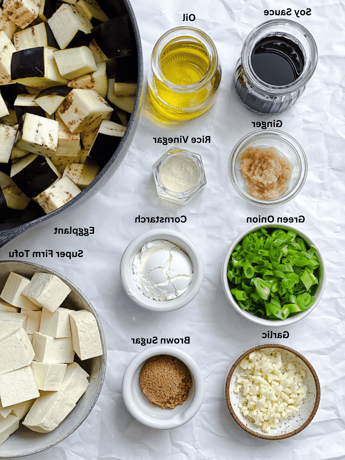 ingredients for Sticky Eggplant and Tofu [Bake + Stir-Fry] measured out on a white surface