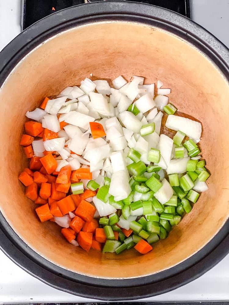 process shot of cooking soup ingredients in pot