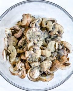 post addition of seasonings to mushrooms in a bowl