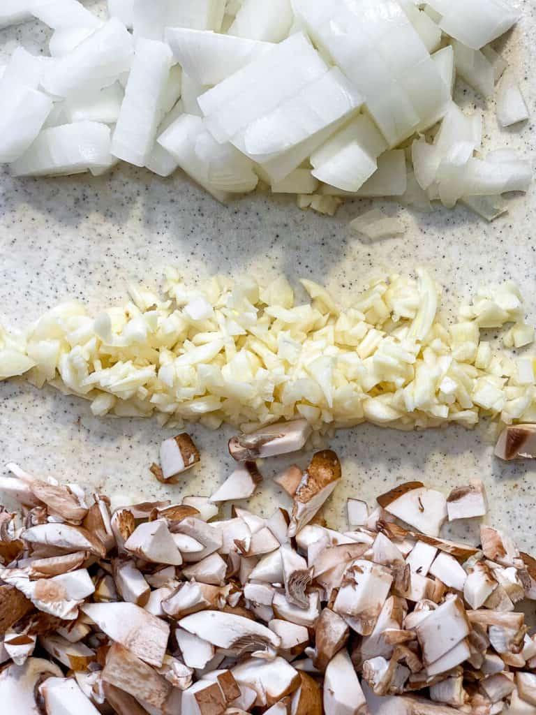 ingredients for Mixed Vegetable Vegan Pot Pie measured out against a white surfaceA