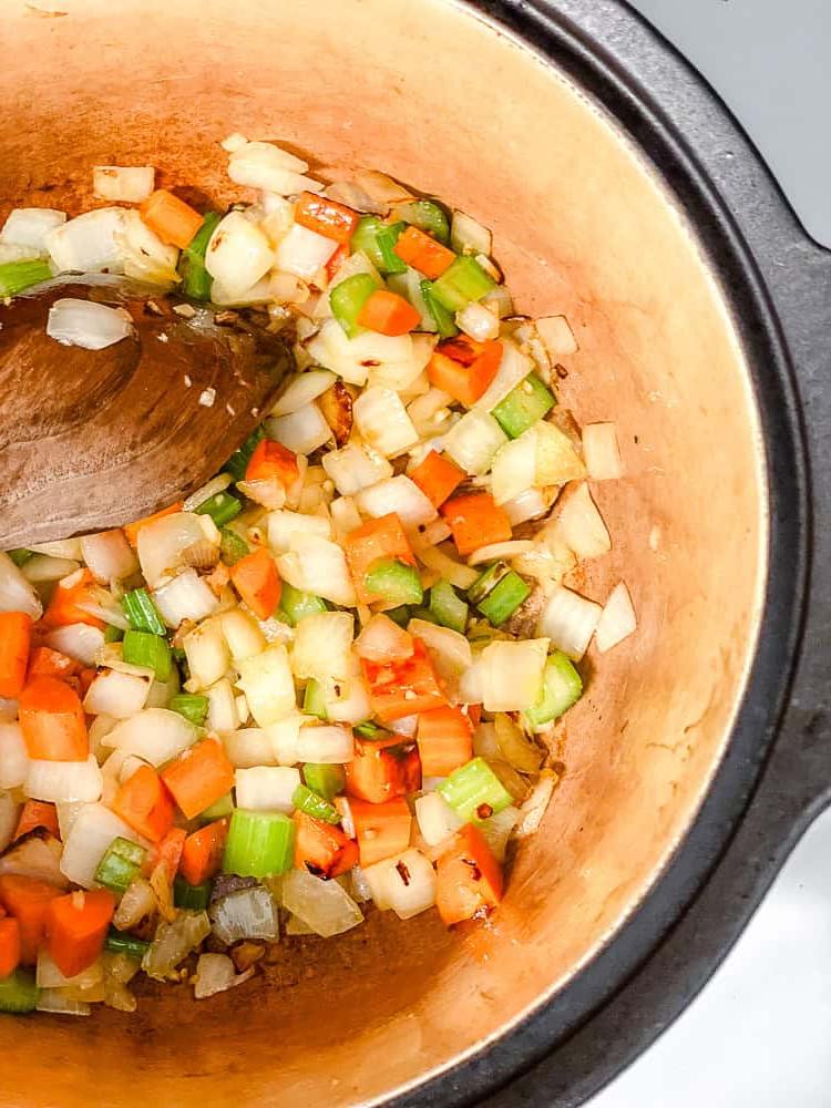 process shot of cooking soup ingredients in pot