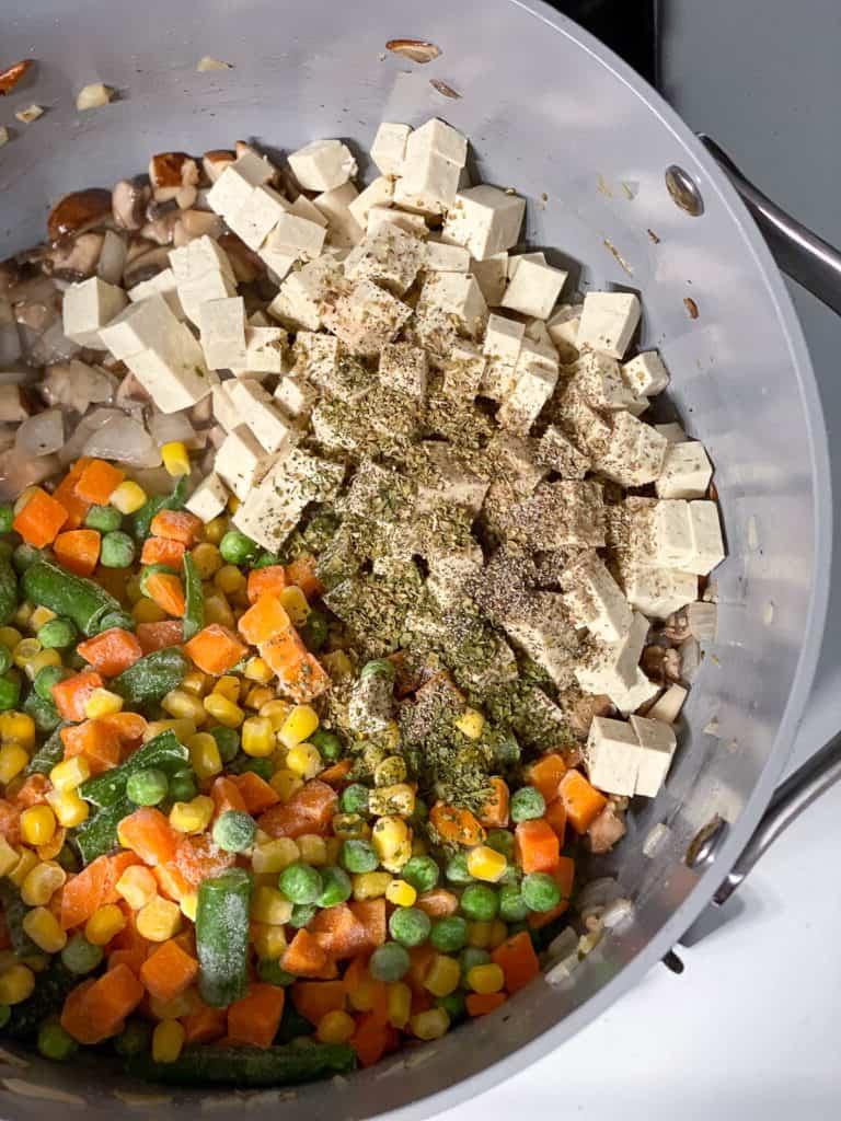 tofu added to pan of ingredients