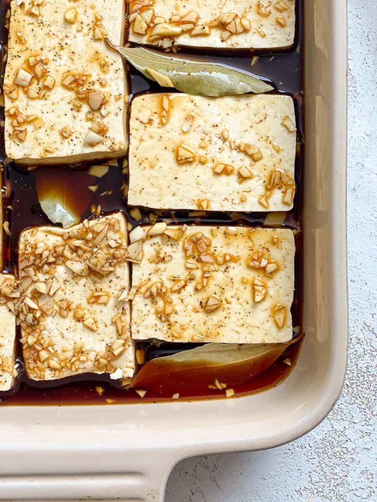 Einfaches Tofu Adobo 10 process shot showing tofu in marinade in container