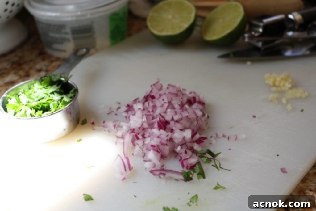 Chopped red onion and cilantro for black bean rice salad 