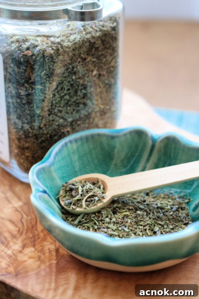 A close-up of dried Herbes de Provence in a bowl, showcasing its rich texture and color.