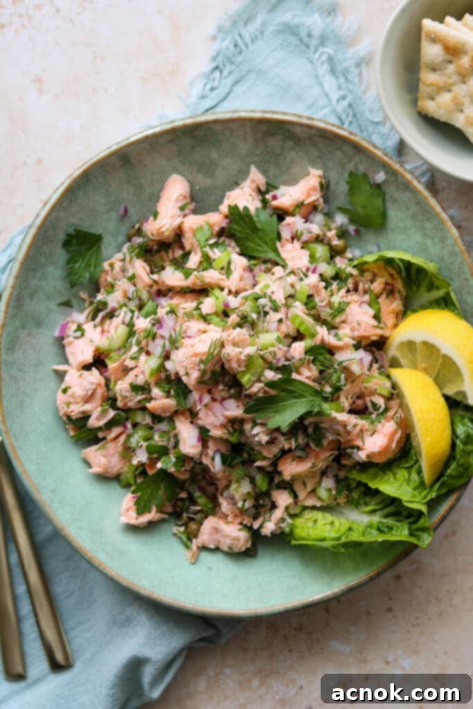 easy chilled poached salmon salad in green plate with crackers