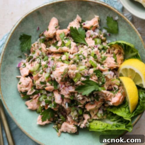 easy chilled poached salmon salad in green plate with crackers