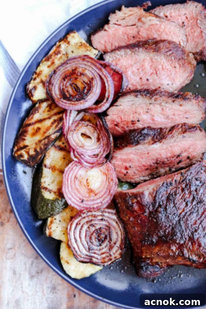 Tri tip on plate, perfectly grilled and sliced