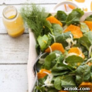 Vibrant Orange Fennel Salad on a plate with fresh orange slices and green fronds.