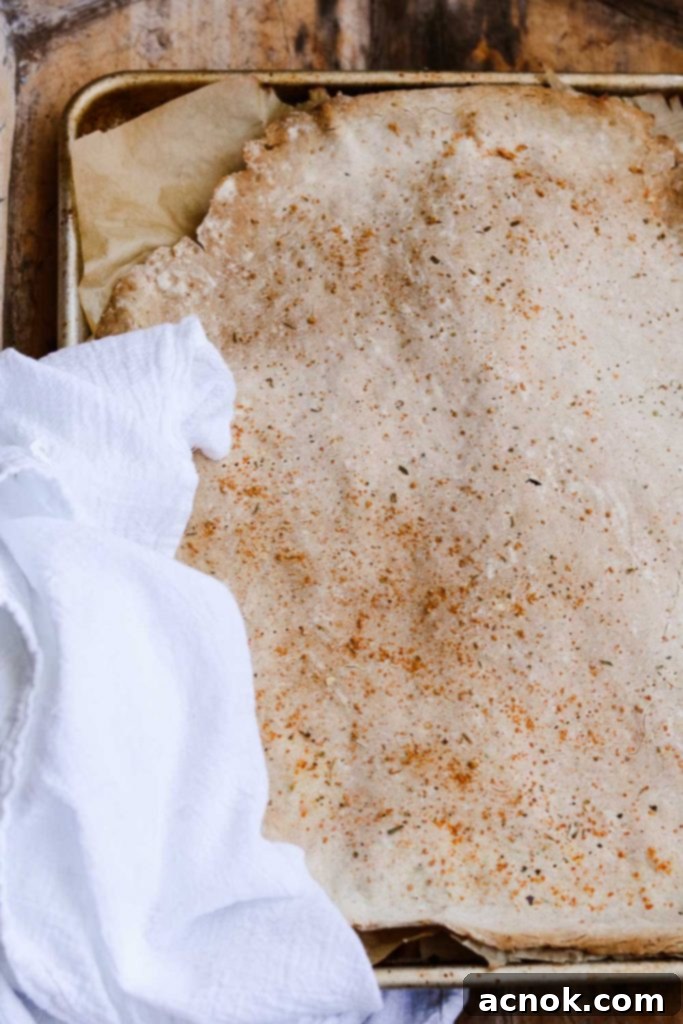 Rustic gluten-free crackers baking on a sheet
