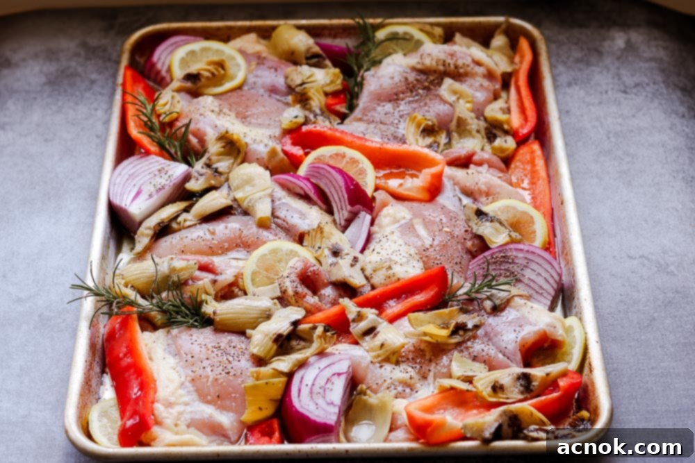 raw chicken on sheet pan