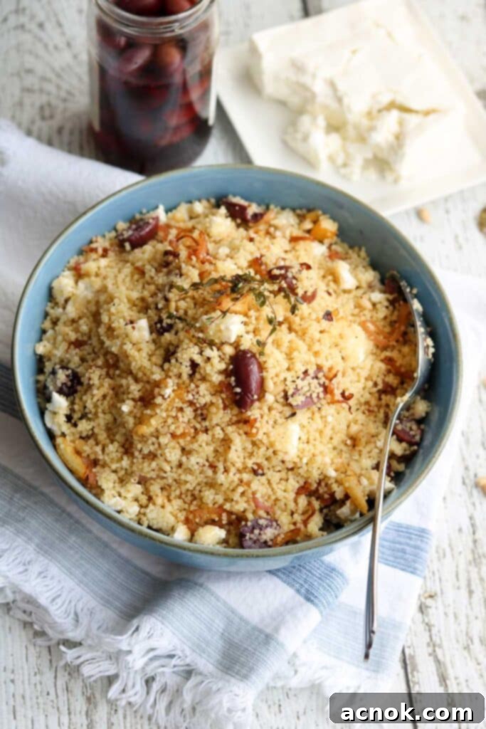 Close-up of fresh Kalamata olives and crumbled feta cheese, key ingredients to enhance plain couscous.