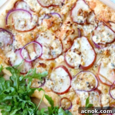 Puff pastry with pears on wood board with arugula
