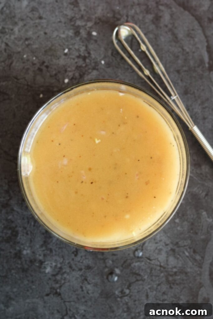 White Balsamic Honey Mustard dressing being whisked in a bowl until fully combined