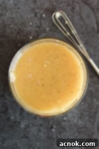 White Balsamic Honey Mustard Vinaigrette in a glass jar, perfectly mixed