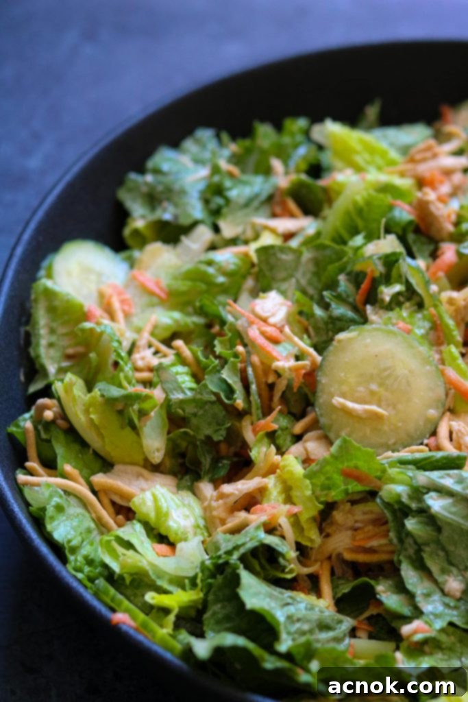 classic chinese chicken salad in black bowl