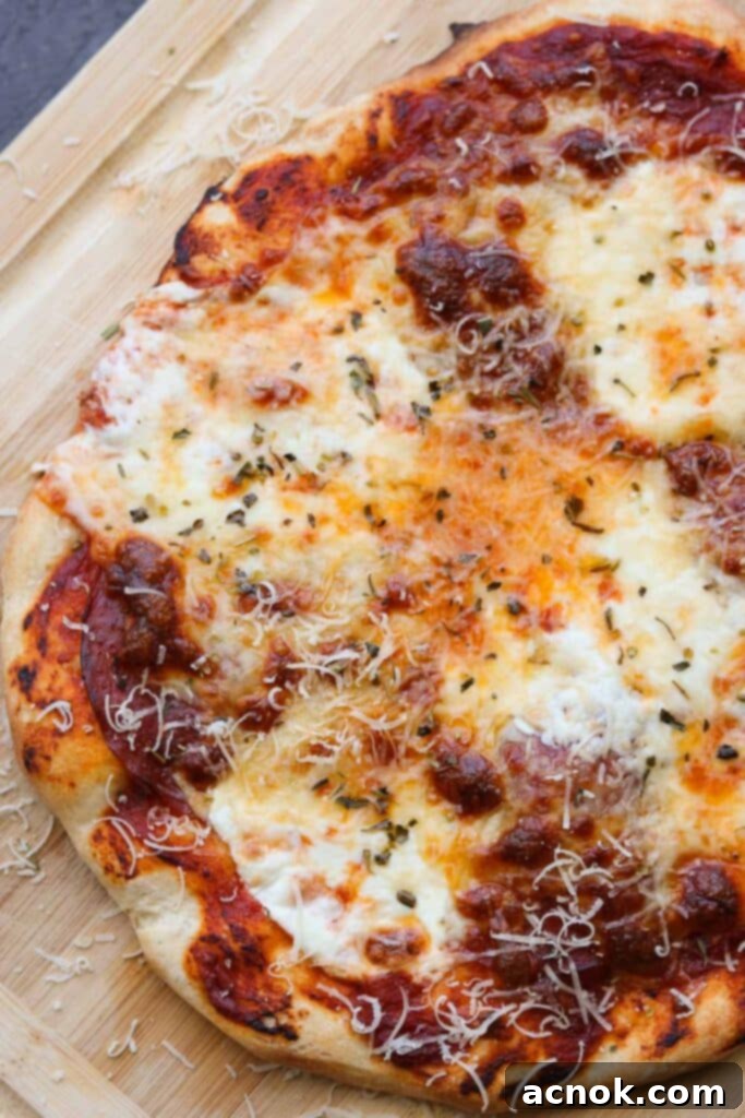 perfect all purpose pizza crust with golden cheese and fresh basil