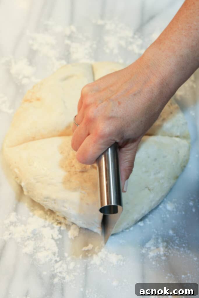pizza dough divided into four equal portions