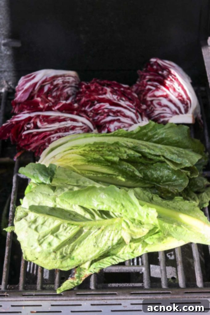 Smoky Grilled Romaine Radicchio Caesar 4 Halves of romaine lettuce being carefully placed onto a hot grill, ready for charring and infusing with smoky flavor