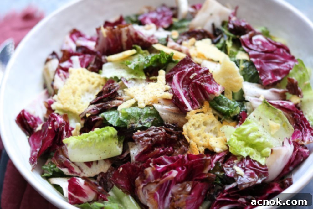 Smoky Grilled Romaine Radicchio Caesar 8 A large serving bowl filled with the finished Grilled Romaine and Radicchio Caesar Salad, ready to be enjoyed
