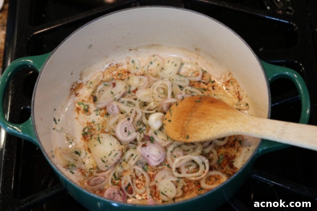 Softened shallots and rosemary in the pan after sautéing for 5 minutes.