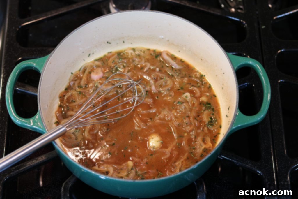 Whisking the sauce ingredients until blended and smooth.