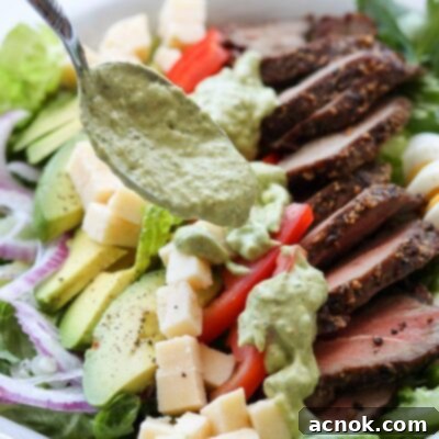 rich and spicy avocado dressing on steak salad