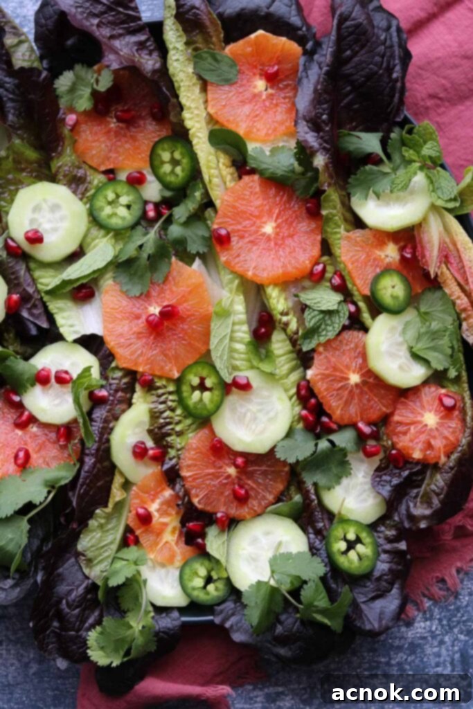 Vibrant Winter Citrus Salad on a plate with a burgundy napkin, showcasing fresh ingredients and bright colors