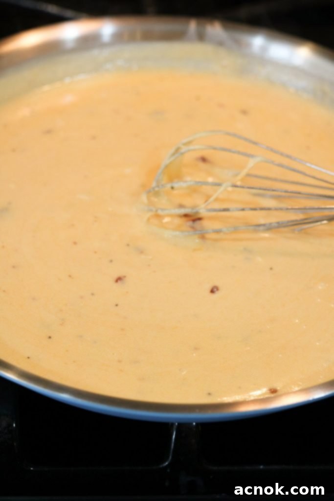 A close-up of the finished chipotle cheddar sauce, rich and ready for pasta