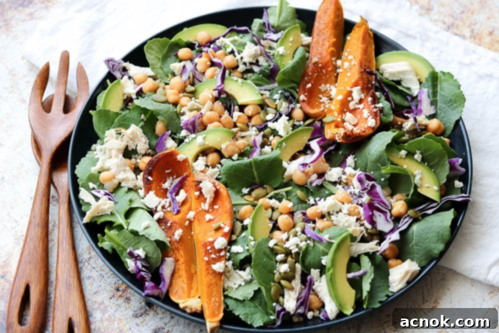 superfood spinach salad with wooden serving set and white napkin 