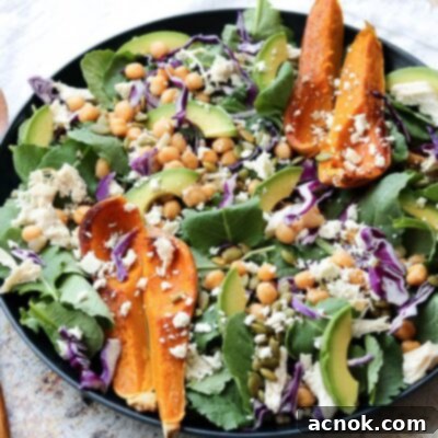 superfood spinach salad with wooden serving set and white napkin