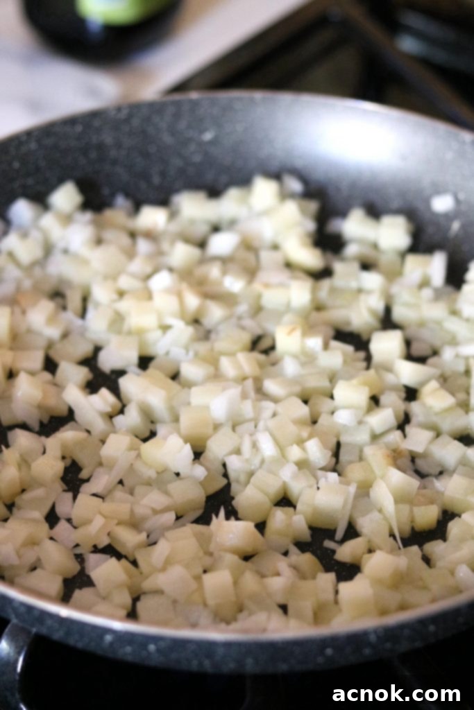 potatoes and onions in skillet, raw