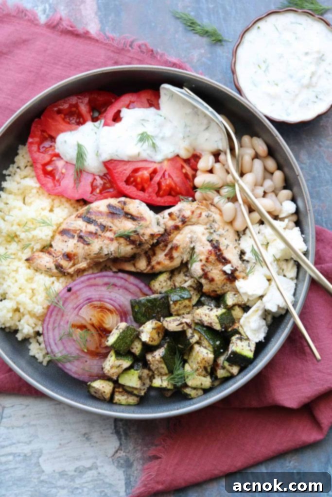 bowl with grilled chicken vegetables with yogurt dill dressing on napkin