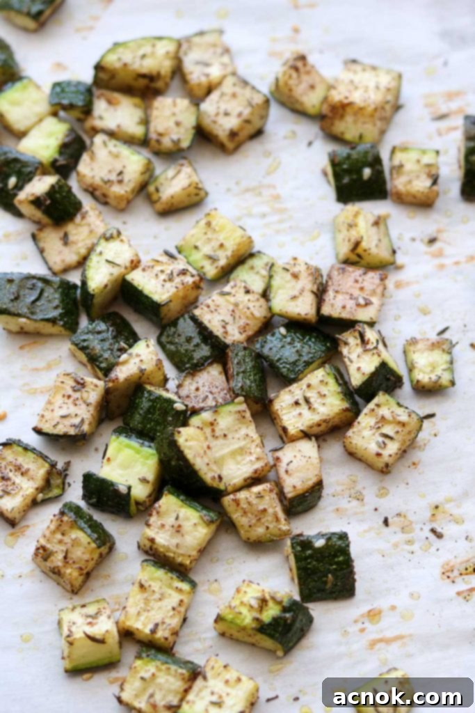 A tastefully arranged plate of perfectly oven roasted Za'atar zucchini, garnished, ready to be served and enjoyed
