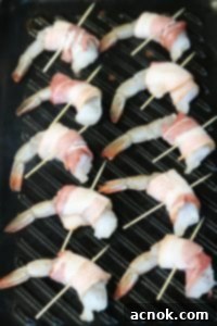 cooking bacon wrapped shrimp on grill