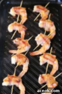 brushing chutney on bacon wrapped shrimp