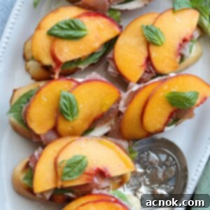 Freshly assembled Peach Prosciutto Mascarpone Crostini on a serving platter