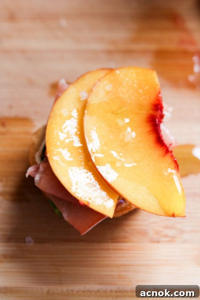 Basil oil and white balsamic vinegar drizzled over assembled crostini