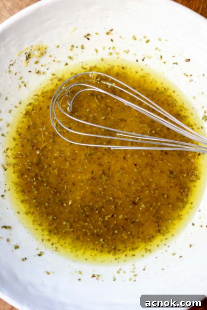 salmoriglio in bowl with whisk
