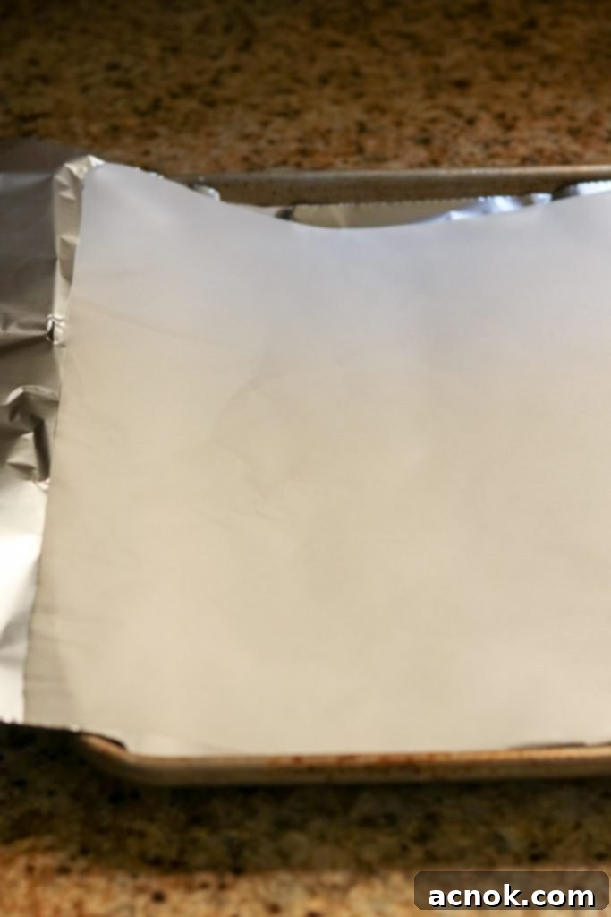 empty sheet pan with foil and parchment
