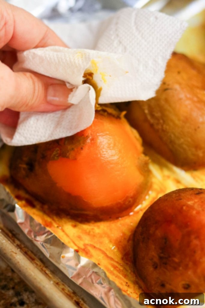 removing skin off roasted beets for roasted golden beet salad with quinoa