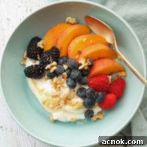 square image of summer fruit bowl with yogurt berries and peaches