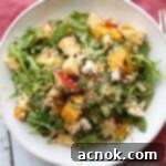 square image of roasted golden beet arugula apple salad