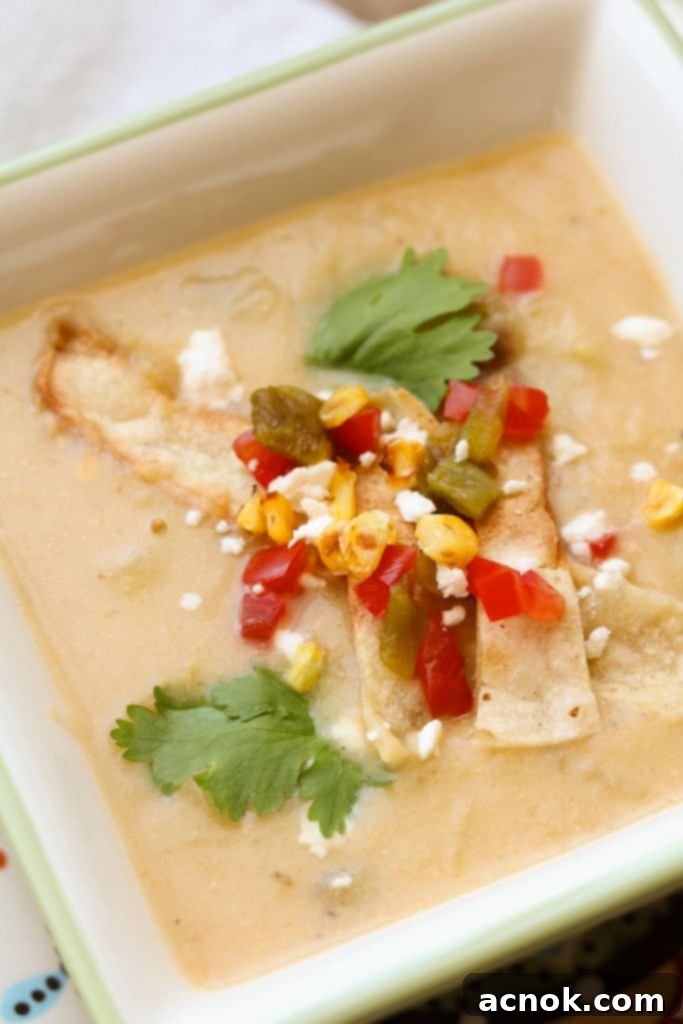 creamy potato hatch Chile soup with toppings