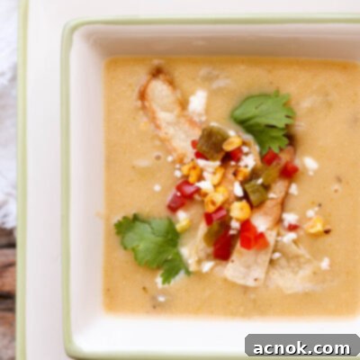 creamy potato hatch chile soup in bowl with napkin