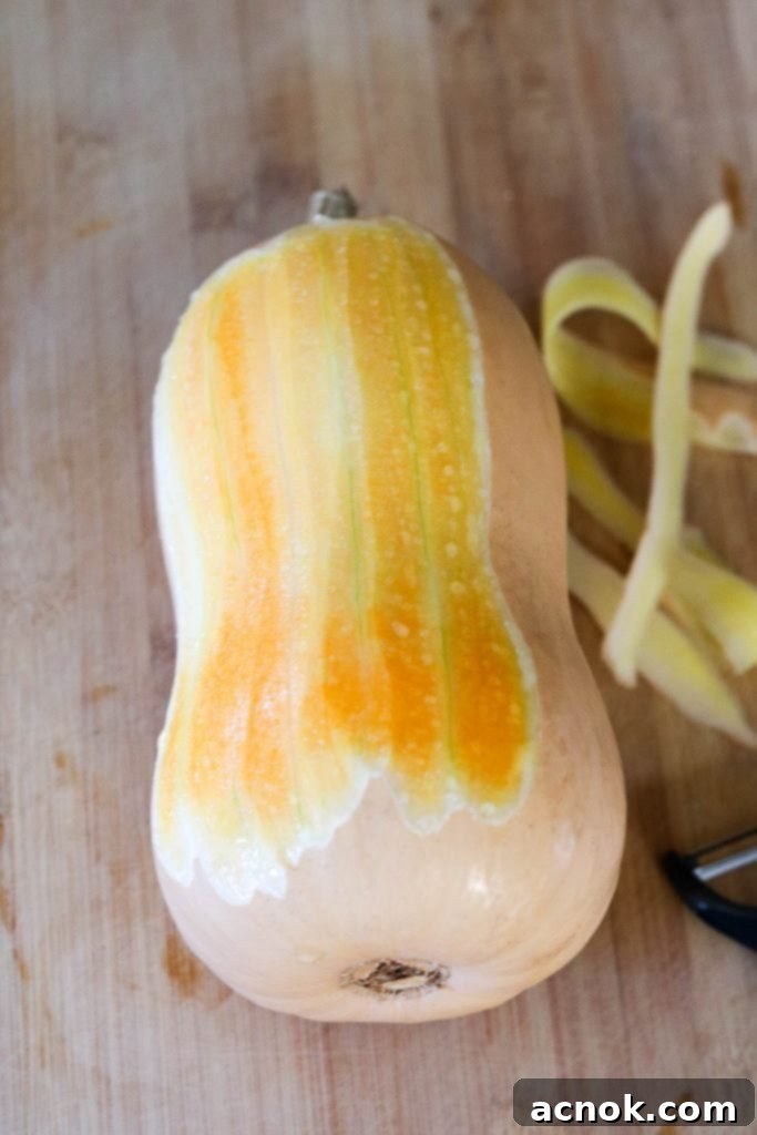 Peeling a butternut squash for Chicken Schnitzel and Autumn Kale Salad.